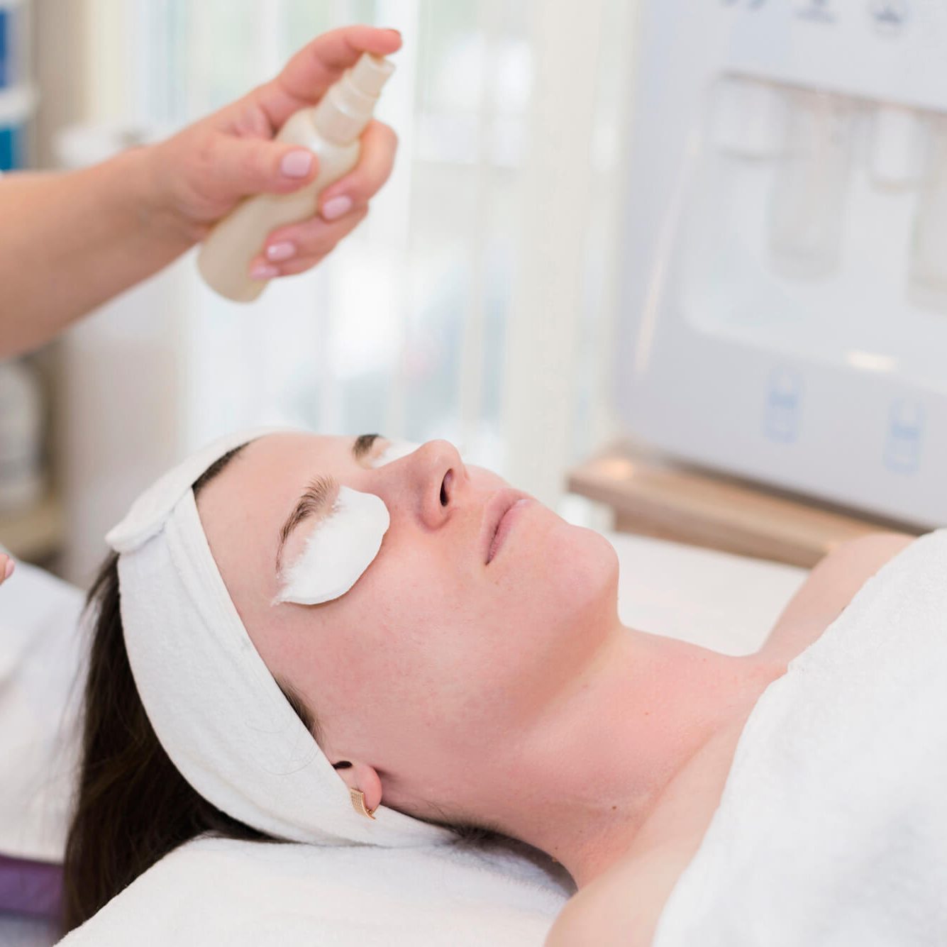 Girl receiving facial treatment in a beauty salon